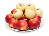 Red and yellow apple on plate