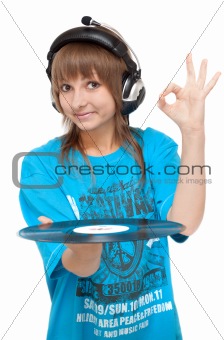 Girl in earphone with vinyl disk in hand, ok