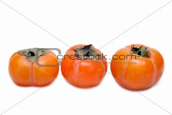 Three persimmons put in row