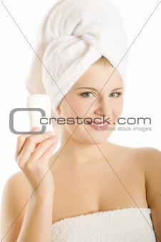 Young beautiful healthy woman with white towel on her head