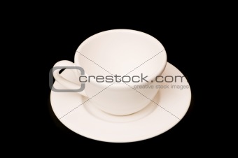 White cup isolated on the black background