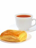 Appetizing puff with tea isolated on a white background 
