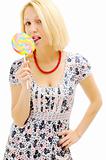 Attractive blonde licking lollipop
