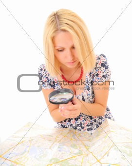 Attractive young blonde studying map