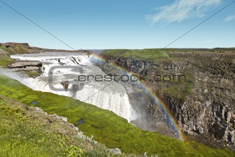 Gullfoss waterfall under a beautiful rainbow