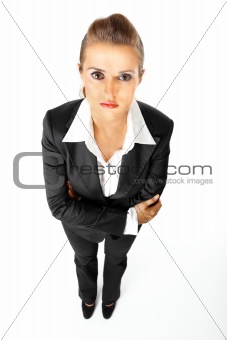 Full length portrait of serious modern business woman with crossed arms on chest
