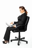  Modern business woman sitting on  chair  and amazedly looks in laptops screen
