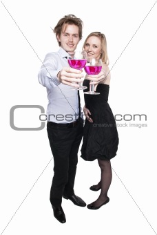 Young couple toasting with pink drink
