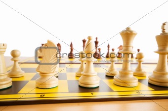Set of chess figures on the playing board 