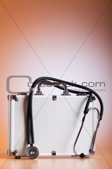 Doctor's case with stethoscope against colorful background