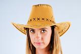 Young girl wearing cowboy hat in the studio