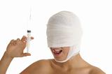 Young woman with bandaged head with syringe