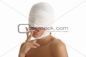 Young woman with bandaged head with cigaret