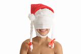 Young woman with bandaged head in Christmas cap