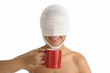 Young woman with bandaged head with red cup