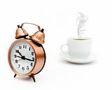 vintage alarm clock and white coffee cup