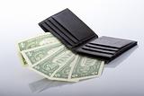 black leather wallet with one dollar banknotes
