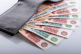 Russian rouble bills in black leather wallet
