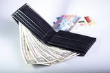 black leather wallet with one dollar banknotes