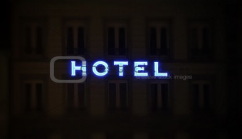 Illuminated hotel sign taken at night