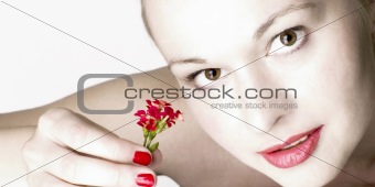 Beautiful woman with red flowers.