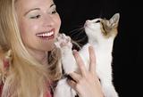 Smiling woman with young cat