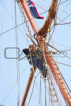 Sailors on old sailing ship