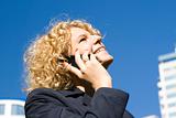 Business woman talks by a mobile phone