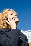Business woman talks by a mobile phone