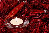 Red Christmas ornaments and candle