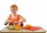 Woman preparing healthy fruit salad