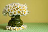 Daisies in a vase and a wreath