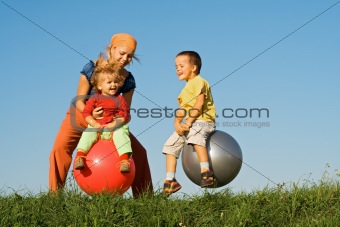 Family jumping on grass