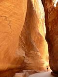 A woman wandering along the Siq in Petra, Jordan