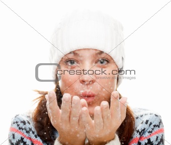 Beautiful woman blowing snow 