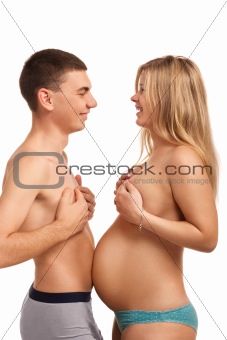 Happy couple - pregnant woman with her husband