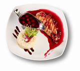 Delicious beef with cherry sauce. File includes clipping path