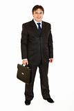 Full length portrait of smiling businessman holding  briefcase in hand
