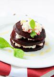 appetizer salad of beets and goat cheese with basil
