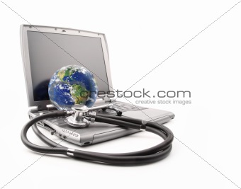 Stethoscope on laptop keyboard with earth on white