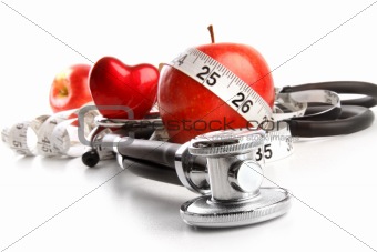 Stethoscope with red apples on white