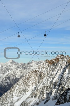 Gondola Ski Lift above Alps Mountains