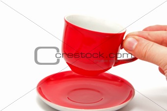 Hand holding a red cup