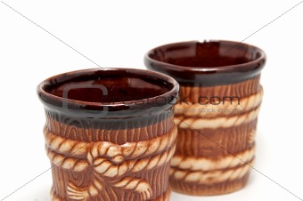 2 brown decorative cups