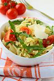 pasta salad with tomatoes and arugula