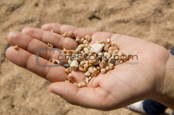 Hand with pink sand