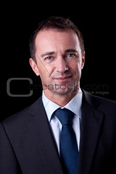 Portrait of a  business man isolated on black background. Studio shot.