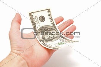 Hand holds 100 U.S. dollars