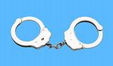Metal handcuffs isolated on the blue background