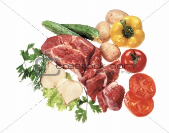raw uncooked meat with vegetables isolated on white